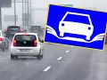 Na drodze mokry ruch, znak ostrzega przed aquaplaningiem. Wegfahrsperre aktiv, bo woda na jezdni może spowodować utratę kontroli.