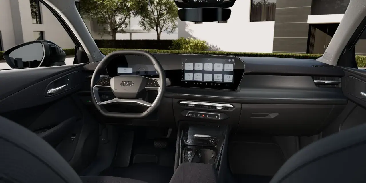 Nowoczesne audi q3 sportback wnętrze z dużym ekranem dotykowym i cyfrowymi zegarami.